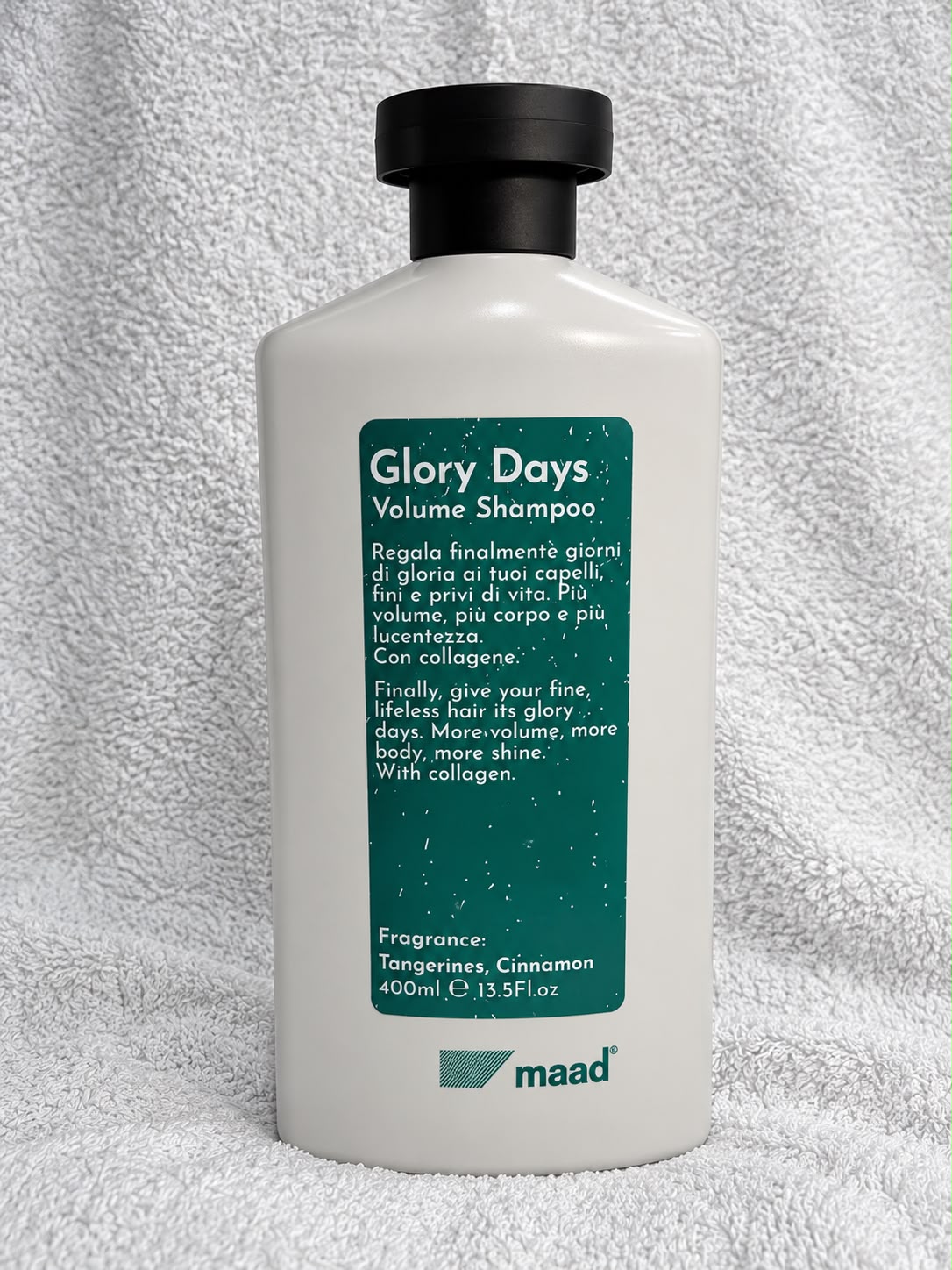 maad Glory Days Volume Shampoo 400 ml bottle with green label on white towel